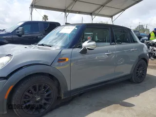 2016 MINI Hardtop 4 Door z VIN WMWXU1C52G2A93506, wystawiony jako IAAI lot #41920473 z przebiegiem 101 635 mil mil oraz . Historia ofert i sprzedaży dostępna na DreamBid. Obrazek 14.