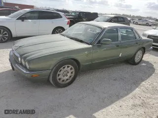 1999 Jaguar XJ with VIN SAJHD1043XC869413, listed as a Copart auction lot 76940624 with 0 mi miles and Salvage Title. Bid and sale history available at carsss.com. Image 1.