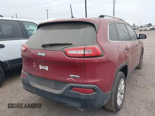 2016 Jeep Cherokee Latitude with VIN 1C4PJLCS1GW247965, listed as a IAAI auction lot 41623805 with 114,187 mi miles. Bid and sale history available at carsss.com. Image 4.