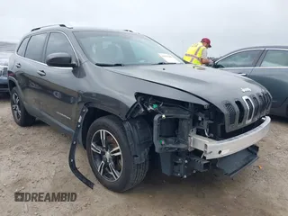 2015 Jeep Cherokee Latitude with VIN 1C4PJLCB0FW601862, listed as a IAAI auction lot 41931048 with 100,705 mi miles and . Bid and sale history available at DreamBid. Image 1.