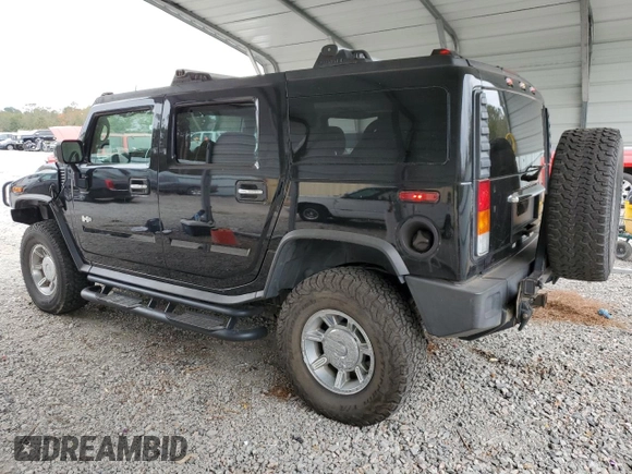 2003 Hummer H2 with VIN 5GRGN23U33H118459, listed as a Copart auction lot 77765694 with 157,390 mi miles and Salvage Title. Bid and sale history available at carsss.com. Image 2.
