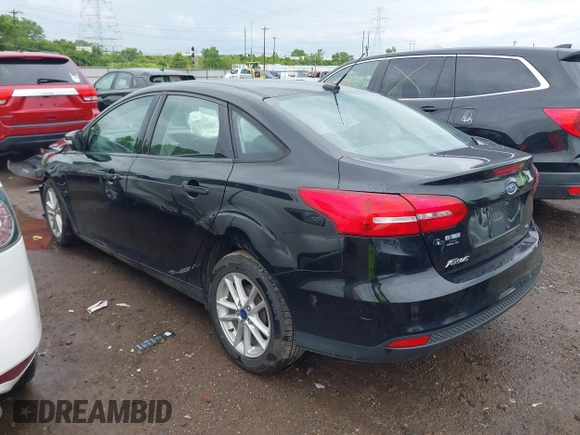 2017 Ford Focus SE z VIN 1FADP3F25HL253466, wystawiony jako IAAI lot #42303404 z przebiegiem 89 779 mil mil oraz . Historia ofert i sprzedaży dostępna na DreamBid. Obrazek 3.