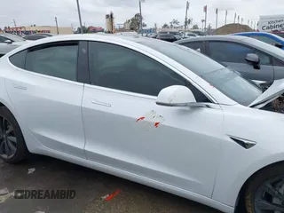 2018 Tesla Model 3 Long Range Battery with VIN 5YJ3E1EA1JF038751, listed as a IAAI auction lot 40553966 with 95,753 mi miles and . Bid and sale history available at DreamBid. Image 12.