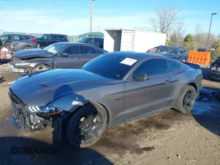 2021 Ford Mustang GT z VIN 1FA6P8CF9M5117126, wystawiony jako IAAI lot #41647619 z przebiegiem 31 076 mil mil oraz . Historia ofert i sprzedaży dostępna na DreamBid. Obrazek 2.