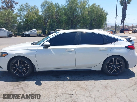 2022 Honda Civic Sport Touring z VIN 19XFL1G82NE000678, wystawiony jako IAAI lot #42221847 z przebiegiem 90 869 mil mil oraz . Historia ofert i sprzedaży dostępna na DreamBid. Obrazek 14.