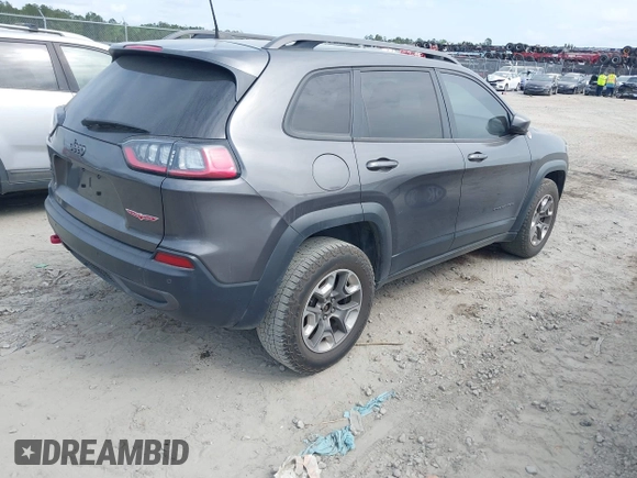 2019 Jeep Cherokee Trailhawk z VIN 1C4PJMBX1KD314121, wystawiony jako IAAI lot #42106721 z przebiegiem 105 631 mil mil oraz . Historia ofert i sprzedaży dostępna na DreamBid. Obrazek 4.