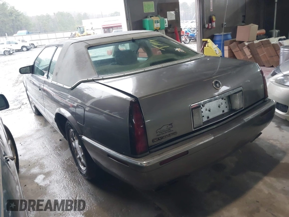 1999 Cadillac Eldorado ESC z VIN 1G6EL12Y8XU612393, wystawiony jako IAAI lot #41761839 z przebiegiem 104 994 mil mil oraz . Historia ofert i sprzedaży dostępna na DreamBid. Obrazek 3.