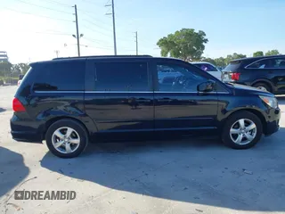 2011 Volkswagen Routan SE with VIN 2V4RW3DG5BR668194, listed as a IAAI auction lot 42483379 with 203,945 mi miles and . Bid and sale history available at DreamBid. Image 13.