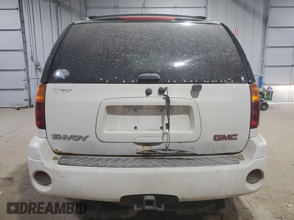2003 GMC Envoy SLE z VIN 1GKDT13S632156357, wystawiony jako Copart lot #41398035 z przebiegiem 160 338 mil mil oraz Szkoda całkowita • Salvage title. Historia ofert i sprzedaży dostępna na DreamBid. Obrazek 6.