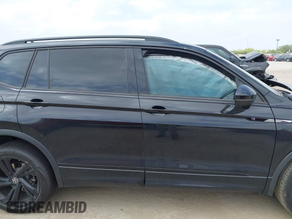 2023 Volkswagen Tiguan SE R-Line Black with VIN 3VVCB7AX0PM122636, listed as a IAAI auction lot 42040494 with 8,589 mi miles and . Bid and sale history available at DreamBid. Image 13.