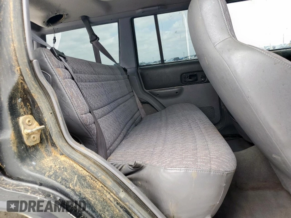 1998 Jeep Cherokee Sport z VIN 1J4FJ68S8WL193483, wystawiony jako Copart lot #58368705 z przebiegiem 94 462 mil mil oraz Szkoda całkowita • Salvage title. Historia ofert i sprzedaży dostępna na DreamBid. Obrazek 11.