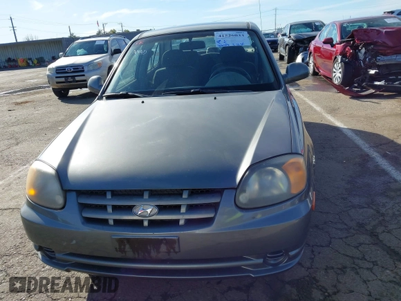 2004 Hyundai Accent GL with VIN KMHCG45C04U531177, listed as a IAAI auction lot 41526033 with 126,102 mi miles. Bid and sale history available at carsss.com. Image 12.