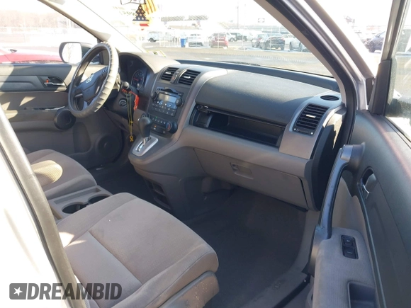 2009 Honda CR-V EX with VIN 3CZRE38589G704086, listed as a IAAI auction lot 41348951 with 128,784 mi miles and . Bid and sale history available at carsss.com. Image 5.