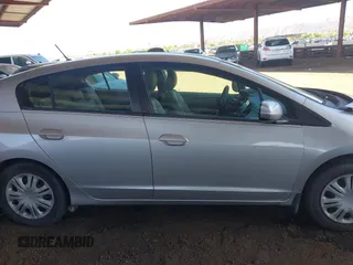 2010 Honda Insight LX z VIN JHMZE2H53AS007016, wystawiony jako IAAI lot #42096274 z przebiegiem 173 519 mil mil oraz . Historia ofert i sprzedaży dostępna na DreamBid. Obrazek 13.