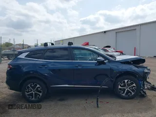 2023 Kia Sportage EX with VIN KNDPVCAGXP7104090, listed as a IAAI auction lot 42144158 with 26,983 mi miles and . Bid and sale history available at DreamBid. Image 14.