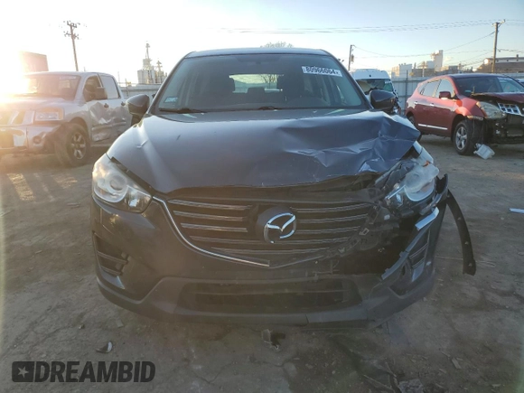 2016 Mazda CX-5 Sport with VIN JM3KE2BY9G0771969, listed as a Copart auction lot 80966064 with 99,348 mi miles and Salvage title. Bid and sale history available at DreamBid. Image 5.