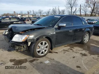 2008 Ford Taurus Limited with VIN 1FAHP25W38G181594, listed as a Copart auction lot 79701014 with 129,968 mi miles and Salvage Title. Bid and sale history available at carsss.com. Image 1.