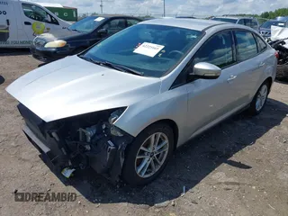 2016 Ford Focus SE z VIN 1FADP3F28GL365676, wystawiony jako IAAI lot #42221665 z przebiegiem 54 899 mil mil oraz . Historia ofert i sprzedaży dostępna na DreamBid. Obrazek 2.