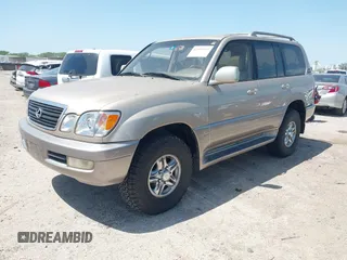 2001 Lexus LX 470 with VIN JTJHT00W613510736, listed as a IAAI auction lot 42005639 with 274,227 mi miles and . Bid and sale history available at carsss.com. Image 2.