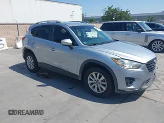 2016 Mazda CX-5 Touring z VIN JM3KE2CY5G0626068, wystawiony jako IAAI lot #42416136 z przebiegiem 183 390 mil mil oraz . Historia ofert i sprzedaży dostępna na DreamBid. Obrazek 1.