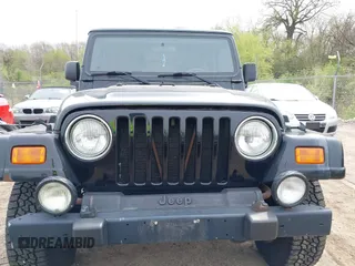 2001 Jeep Wrangler Sahara with VIN 1J4FA59S81P321733, listed as a IAAI auction lot 42164863 with 174,509 mi miles. Bid and sale history available at carsss.com. Image 6.