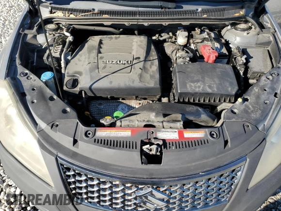 2011 Suzuki Kizashi SE z VIN JS2RE9A30B6110204, wystawiony jako Copart lot #85853384 z przebiegiem 168 962 mil mil oraz Szkoda całkowita • Salvage title. Historia ofert i sprzedaży dostępna na DreamBid. Obrazek 11.