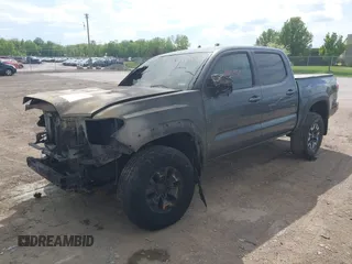 2023 Toyota Tacoma SR with VIN 3TMCZ5AN0PM636306, listed as a IAAI auction lot 42255935 with 14,131 mi miles and . Bid and sale history available at DreamBid. Image 2.