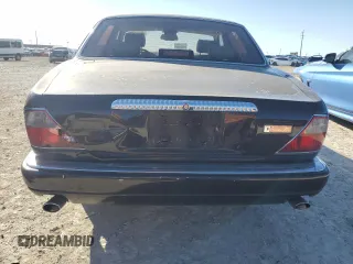 1995 Jaguar XJ with VIN SAJKX1743SC734007, listed as a Copart auction lot 46340825 with 130,115 mi miles and Salvage Title. Bid and sale history available at DreamBid. Image 6.