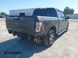 2015 Ford F-150 XL with VIN 1FTEW1CG2FFC70680, listed as a IAAI auction lot 41871782 with 143,875 mi miles. Bid and sale history available at carsss.com. Image 4.