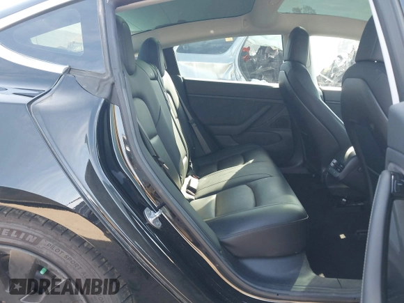 2018 Tesla Model 3 Long Range Battery with VIN 5YJ3E1EA0JF056979, listed as a IAAI auction lot 41865849 with 97,319 mi miles. Bid and sale history available at carsss.com. Image 8.