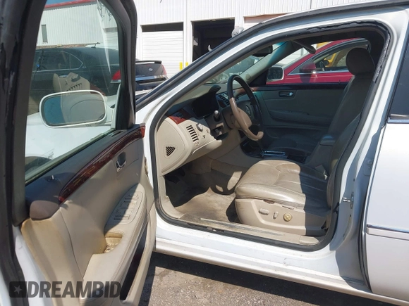 2006 Cadillac DTS w/1SC with VIN 1G6KD57Y56U132648, listed as a IAAI auction lot 41862030 with 128,003 mi miles. Bid and sale history available at carsss.com. Image 5.