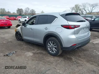 2023 Mazda CX-5 S Carbon Edition z VIN JM3KFBCMXP0265141, wystawiony jako IAAI lot #41946750 z przebiegiem Nie podano mil oraz . Historia ofert i sprzedaży dostępna na DreamBid. Obrazek 3.