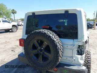 2020 Jeep Wrangler Unlimited Sahara with VIN 1C4HJXEN4LW330867, listed as a IAAI auction lot 41790709 with 63,151 mi miles. Bid and sale history available at carsss.com. Image 16.
