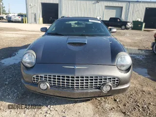 2003 Ford Thunderbird Deluxe z VIN 1FAHP60A63Y107026, wystawiony jako Copart lot #70650964 z przebiegiem 36 115 mil mil oraz Szkoda całkowita • Salvage title. Historia ofert i sprzedaży dostępna na DreamBid. Obrazek 5.