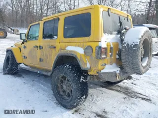 2019 Jeep Wrangler Unlimited Sahara Altitude with VIN 1C4HJXEG3KW580097, listed as a IAAI auction lot 41345888 with 56,592 mi miles. Bid and sale history available at carsss.com. Image 3.