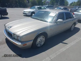 1997 Jaguar XJ with VIN SAJHX1243VC811674, listed as a IAAI auction lot 42333801 with 213,248 mi miles and . Bid and sale history available at DreamBid. Image 2.