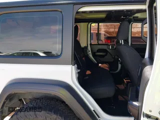 2020 Jeep Wrangler Unlimited Sport with VIN 1C4HJXDG0LW174393, listed as a IAAI auction lot 41575040 with 68,418 mi miles and . Bid and sale history available at DreamBid. Image 8.