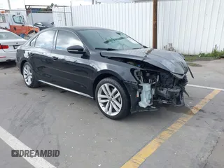 2019 Volkswagen Passat 2.0T Wolfsburg Edition with VIN 1VWLA7A34KC012887, listed as a IAAI auction lot 41792604 with 70,237 mi miles. Bid and sale history available at carsss.com. Image 1.