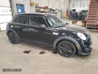 2016 MINI Cooper Hardtop 4 Door S with VIN WMWXU3C5XG2B63166, listed as a Copart auction lot 84016934 with 58,921 mi miles and Salvage Title. Bid and sale history available at carsss.com. Image 4.