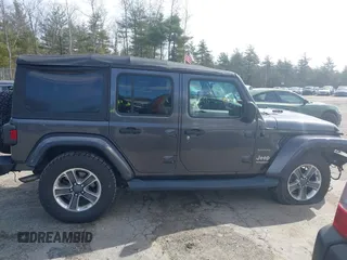 2018 Jeep Wrangler Unlimited Sahara with VIN 1C4HJXEG0JW246110, listed as a IAAI auction lot 41826662 with 65,236 mi miles. Bid and sale history available at carsss.com. Image 13.