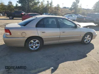 2001 Cadillac Catera z VIN W06VR54R21R039740, wystawiony jako Copart lot #77206494 z przebiegiem 41 180 mil mil oraz Szkody całkowita. Historia ofert i sprzedaży dostępna na DreamBid. Obrazek 3.