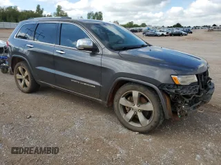 2015 Jeep Grand Cherokee Overland with VIN 1C4RJFCT4FC813510, listed as a Copart auction lot 41466395 with 135,124 mi miles and Salvage Title. Bid and sale history available at carsss.com. Image 4.