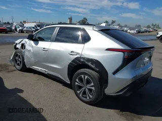 2024 Toyota bZ4X XLE with VIN JTMABACA7RA079957, listed as a IAAI auction lot 40566017 with 231 mi miles and . Bid and sale history available at DreamBid. Image 3.