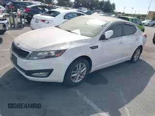 2013 Kia Optima LX with VIN 5XXGM4A79DG193534, listed as a IAAI auction lot 41690584 with 100,287 mi miles. Bid and sale history available at carsss.com. Image 2.