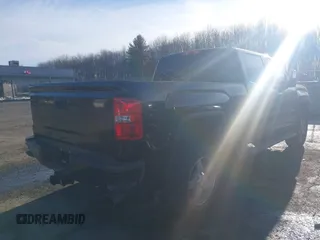 2017 GMC Sierra 2500HD SLT with VIN 1GT12TEY1HF213286, listed as a IAAI auction lot 41696875 with 55,047 mi miles. Bid and sale history available at carsss.com. Image 4.