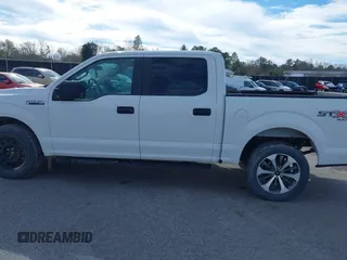 2019 Ford F-150 XL with VIN 1FTEW1E51KFC52807, listed as a IAAI auction lot 41383212 with 124,244 mi miles and . Bid and sale history available at DreamBid. Image 14.