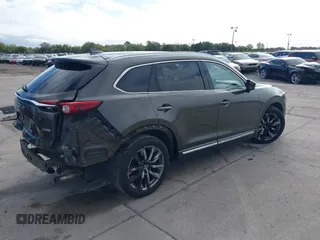 2017 Mazda CX-9 Grand Touring with VIN JM3TCADY7H0133092, listed as a IAAI auction lot 41133652 with 233,454 mi miles and . Bid and sale history available at DreamBid. Image 4.