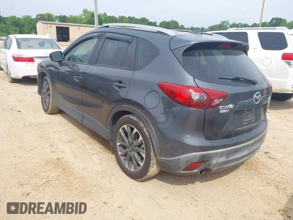 2016 Mazda CX-5 Grand Touring z VIN JM3KE2DY5G0801238, wystawiony jako IAAI lot #42264694 z przebiegiem 136 993 mil mil oraz . Historia ofert i sprzedaży dostępna na DreamBid. Obrazek 3.
