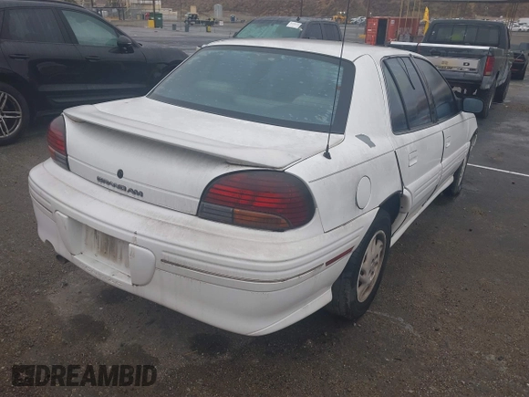 1998 Pontiac Grand Am SE2 with VIN 1G2NE52T7WM513702, listed as a IAAI auction lot 41503141 with 302,315 mi miles. Bid and sale history available at carsss.com. Image 4.