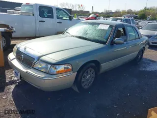 2005 Mercury Grand Marquis GS with VIN 2MEFM74W35X653175, listed as a IAAI auction lot 42005035 with 142,935 mi miles. Bid and sale history available at carsss.com. Image 2.